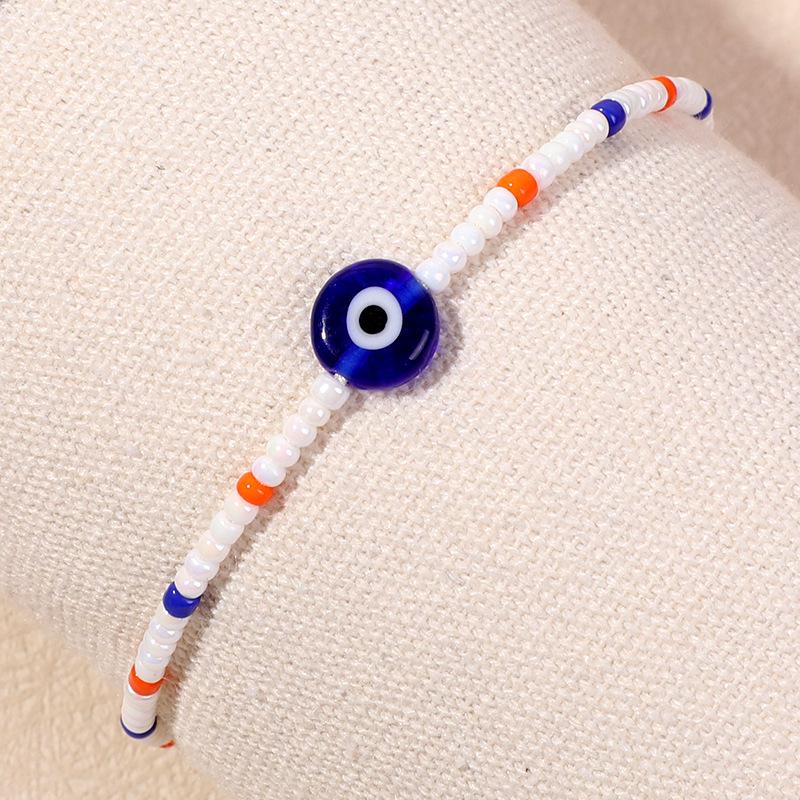 Bracelet en perles d'œil du diable tissé à la main avec motif de niche en verre