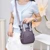 Kompakt Nylon Crossbody Miniryggsäck med Topphandtag Casual Liten Dagryggsäcksväska för Kvinnor Daglig Resa