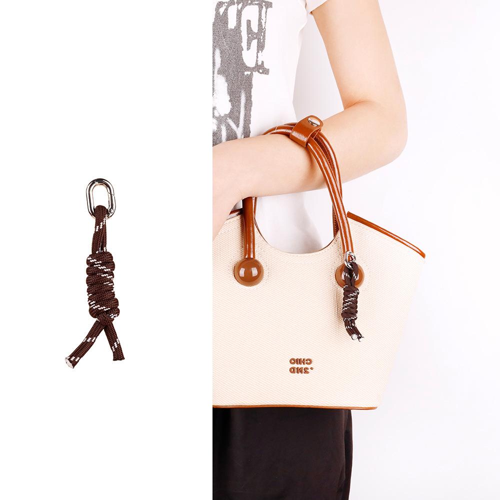 

Internet celebrity new personalized creative handwoven bag pendant shipping foot bell niche light luxury keychain pendant wholesale