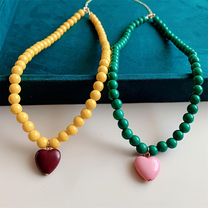 A Trendy New Colorful Bead Necklace Featuring a Unique Heart-Shaped Pendant, Perfect for Women Who Love Fashionable Handmade