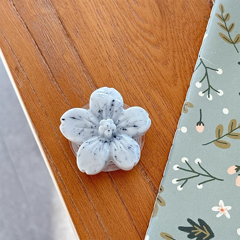 

Solid Color Three-Dimensional Flower Mobile Phone Airbag Bracket Cherry Blossom Paste Ring Watching Drama Desktop Bracket Female