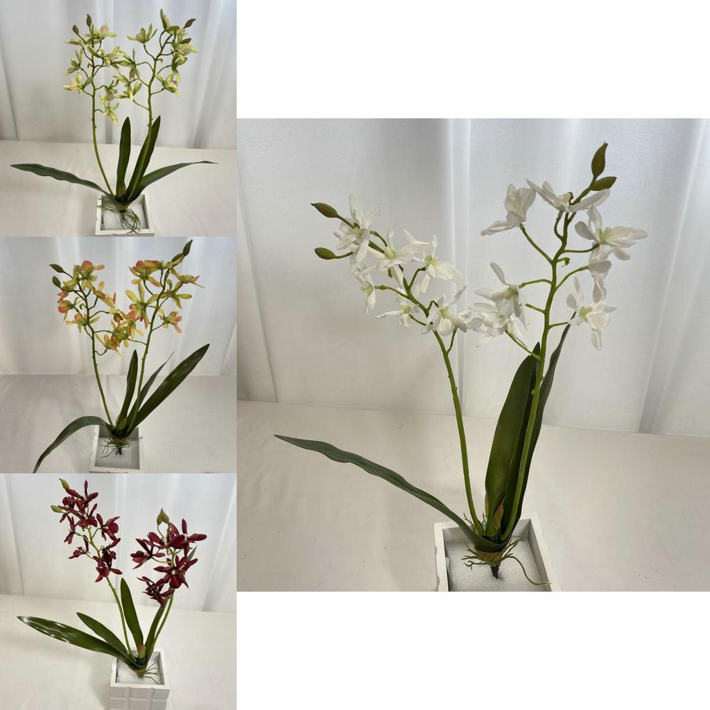 Realistische Seiden-Dendrobium-Orchidee mit Blättern für Blumengesteck auf dem Esstisch