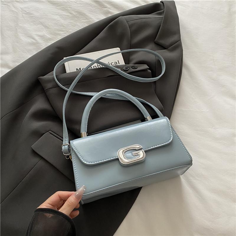 

ins niche French textured bag women s 2025 summer new lock small square bag foreign style shoulder messenger bag синій