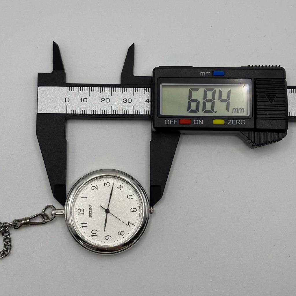 Used Working 95s vintage Seiko pocket watch with original chain, quartz