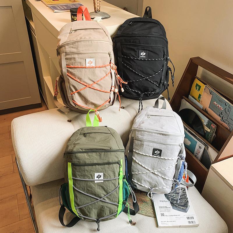 Schoolbag outdoor backpack Korean version drawstring splicing mountaineering bag large capacity anti-splashing fashion simple casual backpack