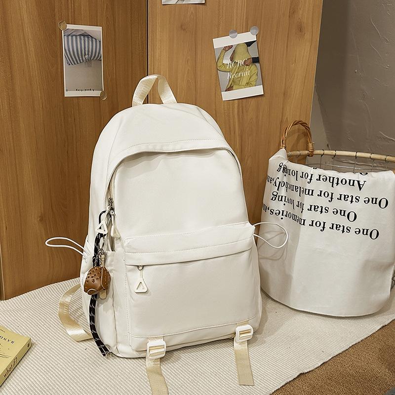 Schoolbag1011 new versatile black schoolbag male college student large capacity backpack female junior high school girl solid color backpack