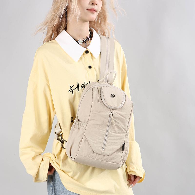 Schoolbag Large capacity breast bag Multifunctional small backpack Short trip bag Women's new solid color small backpack Fashion women's backpack