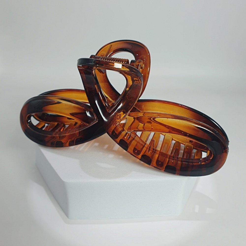 

Domestically produced sturdy women s round hair clip, brown