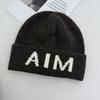 Niche personalized letter knitted hat children's autumn and winter new wool hat warm ear protector bag head cold hat