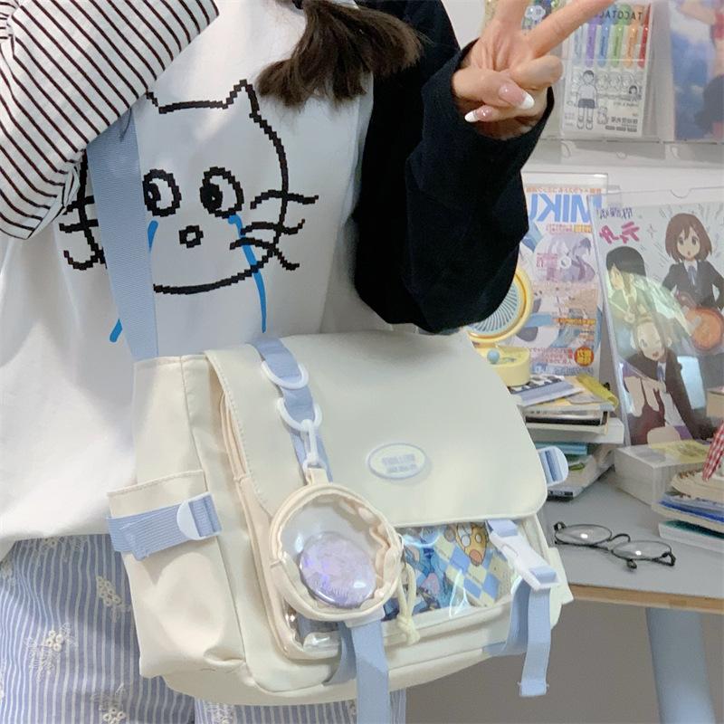 

New Japanese high-value college style two-dimensional girl bar pain bag casual simple and light commuter messenger bag
