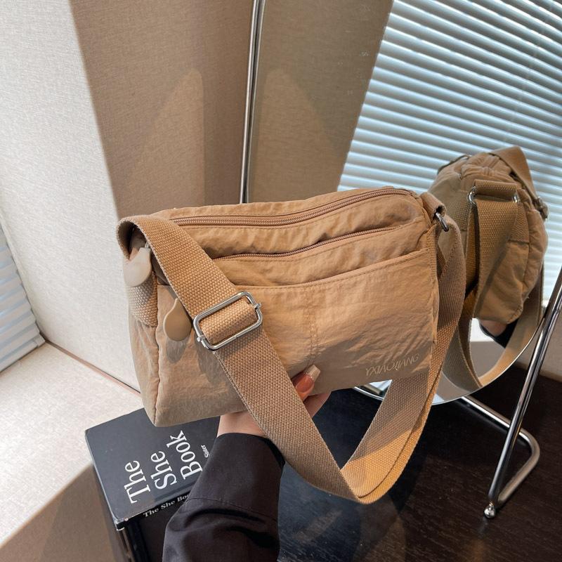 

2025 summer new women s messenger bag anti-splashing ultra-light cloth bag multi-compartment small square bag solid color shoulder messenger bag хаки