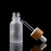 Tomma droppflaskor av glas Ögonpipett Trä Bambu Lock eteriska oljor 5Ml-100Ml