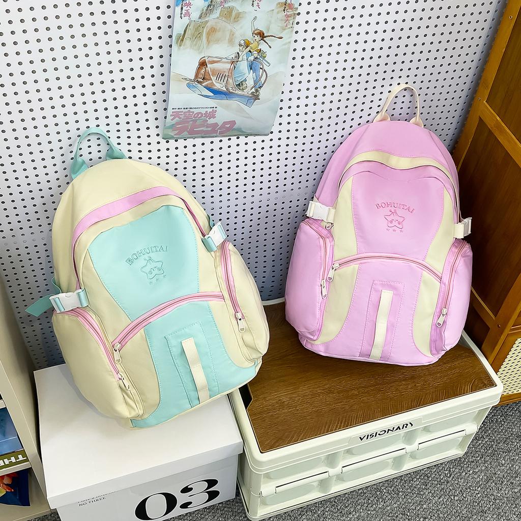 Korean version of large-capacity junior high school student schoolbag travel backpack high-value ins wind niche contrasting color backpack women