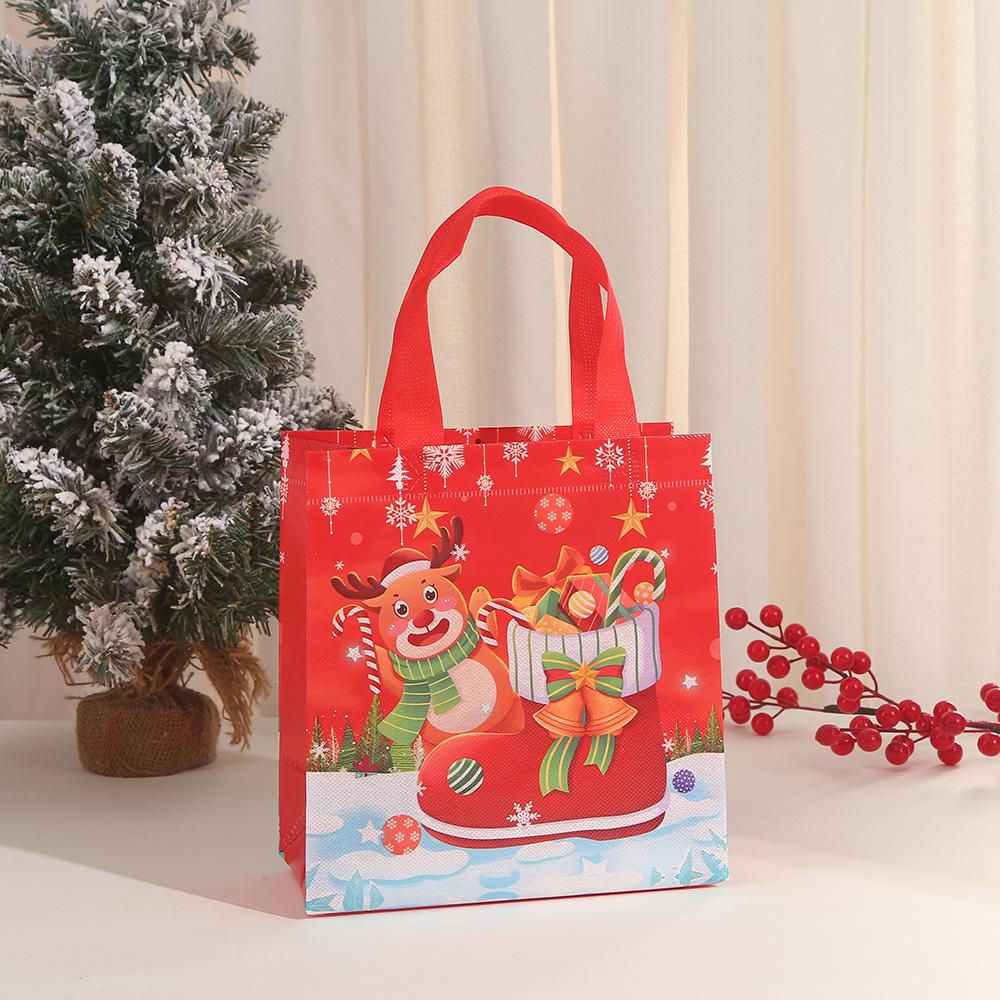 

Merry Christmas Gift Bags with Handle Non-Woven Fabrics Santa Claus Snowman Candy Snacks Packing Pouch Christmas Party Deco 29x27x12cm