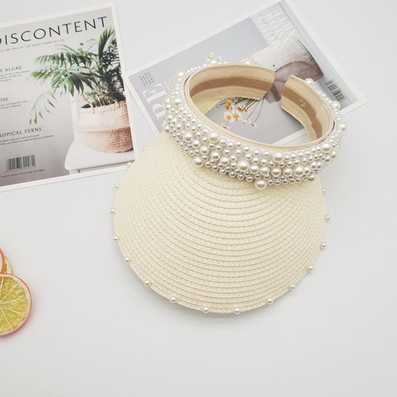 Straw hat spring and summer women's pearl fixed diamond empty top hat ins wind straw woven pearl strip big eaves sun protection monochrome sun hat