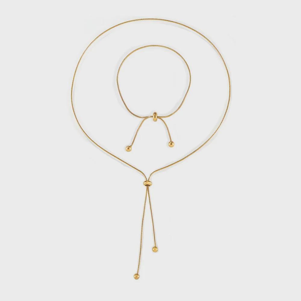 Stylish Non-Fade Round Bead Pull-Out Buckle Women’s 18K Gold-Plated Titanium Steel Jewelry Set: Tassel Necklace, Bracelet, Anklet.