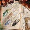 4pcs Elegant Metal Feather Bookmarks with Pendant Charms – Golden, Blue, Yellow, and Brown Iron Bookmarks for Birthdays Gift