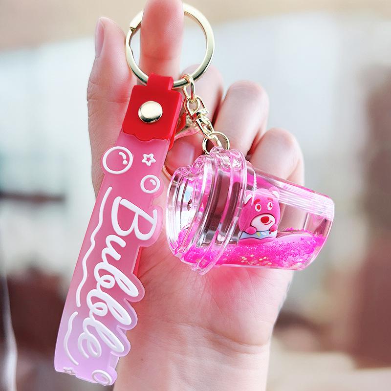 Strawberry Bear Doll Keychain with Colorful Oil-Filled Bottle and Milk Tea Cup Pendant