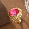 Vintage Hollow Copper Ring with Oval Red Artificial Gem for Women, Suitable for Banquets and Formal Occasions.