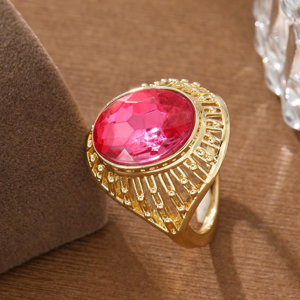 Vintage Hollow Copper Ring with Oval Red Artificial Gem for Women, Suitable for Banquets and Formal Occasions.