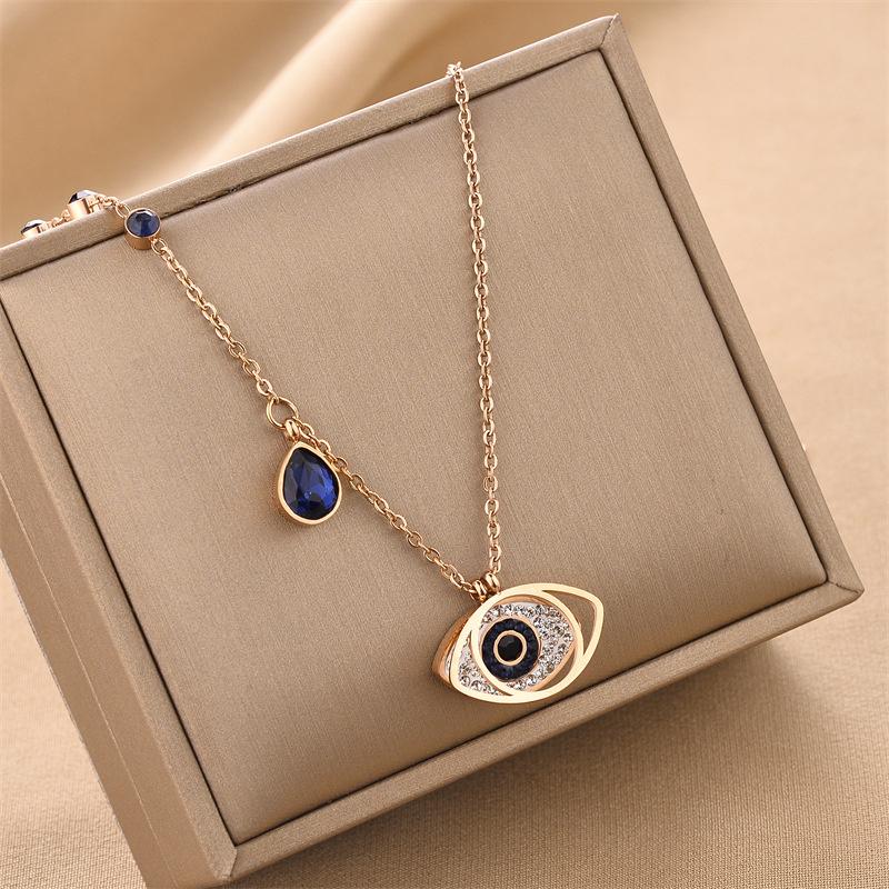 Goldene 316L Edelstahl Nazar-Anhänger Halskette mit blauen Edelsteinen und funkelnden Zirkonia für Damen