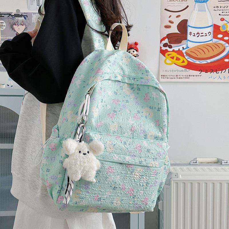 Korean ins cute little floral high-value schoolbag junior high school girls large-capacity backpack high school students casual shoulders