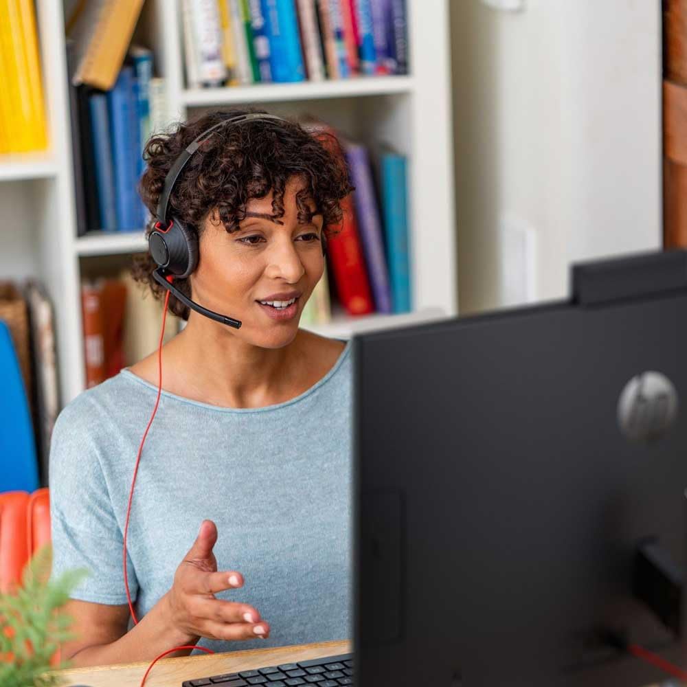 Poly (older model) wired headset, BlackWire 5210, USB-C connection, single ear, noise-canceling.