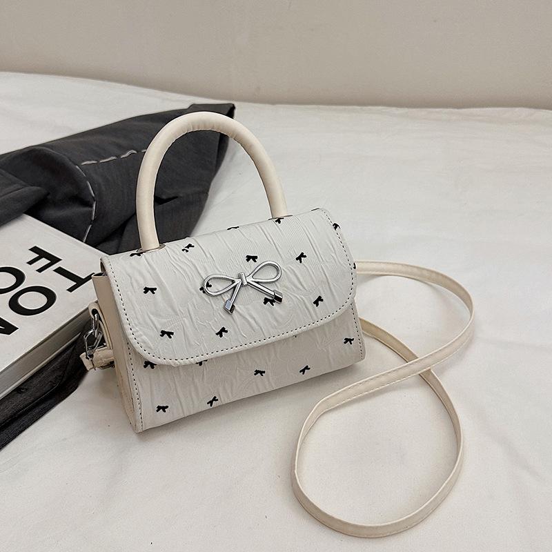 

Bow casual fashion 2025 summer new simple design sense love foreign style shoulder handbag women