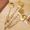 Gold Stainless Steel Kitchen Utensil Set: Shovel, Frying Spoon & Large Soup Spoon.