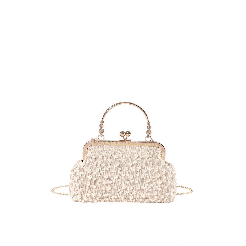 Dámská elegantní crossbody kabelka s kamínky na rameno, skořápka, jaro 2025