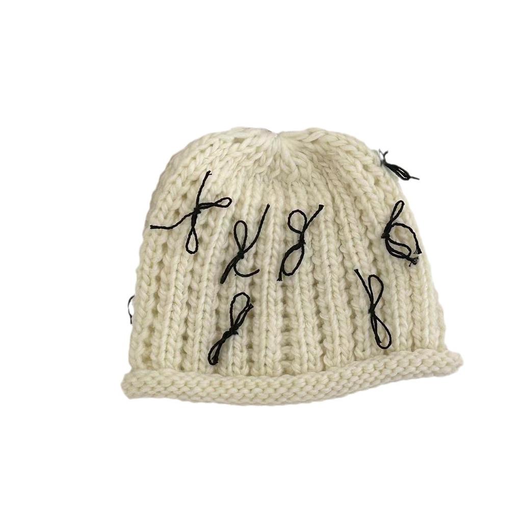 Autumn and winter crimped bow knitted bag head fashionable cold hat women's trendy new wool hat warm and sweet