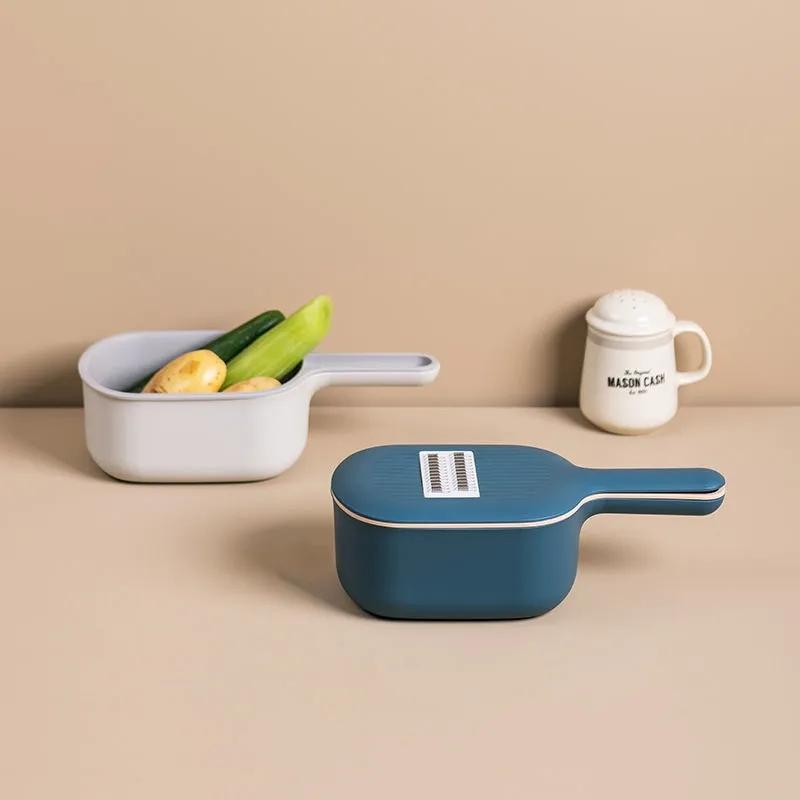 Forniture da cucina Tagliaverdure multifunzione Grattugia per artefatti Patatine fritte Tritatutto domestico Cestello di scarico Macchina affettatrice per pomodori e carote Tritatutto