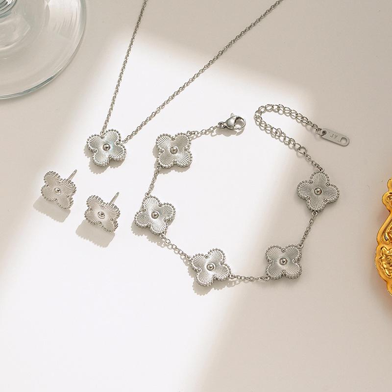 Elegant Four-Leaf Clover Necklace & Bracelet Set - Titanium Steel, Laser-Cut Design, Stylish for European & American Fashion.