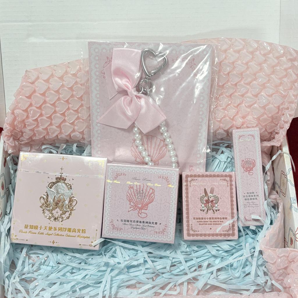Flower Knows Surprise Blind Box Set (3-4 products) with randomly included items such as eyeshadow, blush, lipstick, and small accessories.