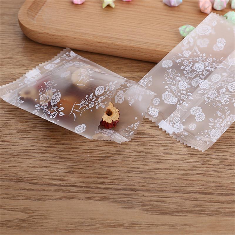 100Pcs Translucent Frosted Rose Flower Pattern Fruit Tea Candy Cookie Machine Sealed Bags Plastic Packaging
