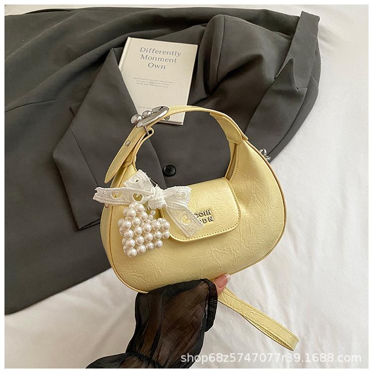 Super fire small bag women 2025 new hand carry crescent bag commuter messenger bag one shoulder armpit dumpling bag