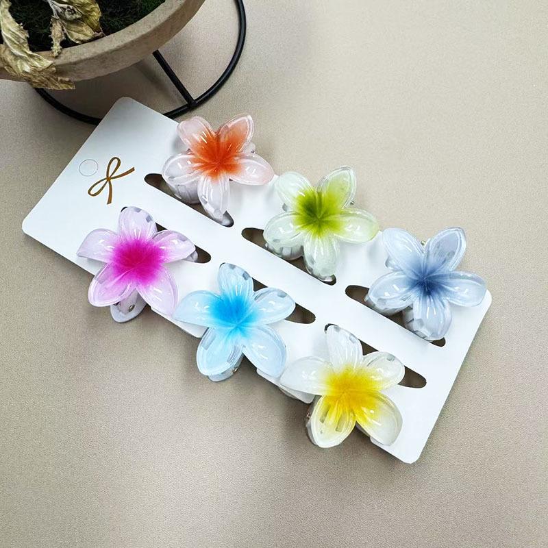 European & American 4CM Frangipani Claw Clip Hairpin - Fashionable Vacation Floral Accessory.
