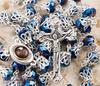 Catholic necklace with deep blue crystal crown beads, rosary, sacred earth medal and cross.