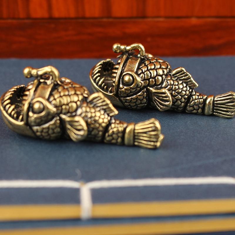 Elegant Brasses Lanterns Fish Figurine as Tabletops Decoration Adding Retros Charm to Interior Space