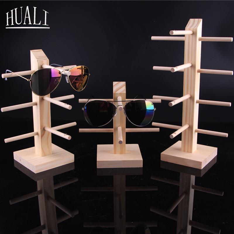 Stojak podłogowy z litego drewna na oprawki okularów i okulary przeciwsłoneczne