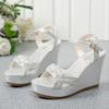 Summer new one-word buckle with high heels fashion sandals women's large size woven belt muffin thick-soled wedge sandals