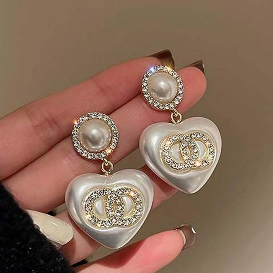 

2025 Новые серьги Love из стерлингового серебра S925: Уникальные антиаллергенные застежки для ушей для женщин - легкий роскошный дизайн осень/зима