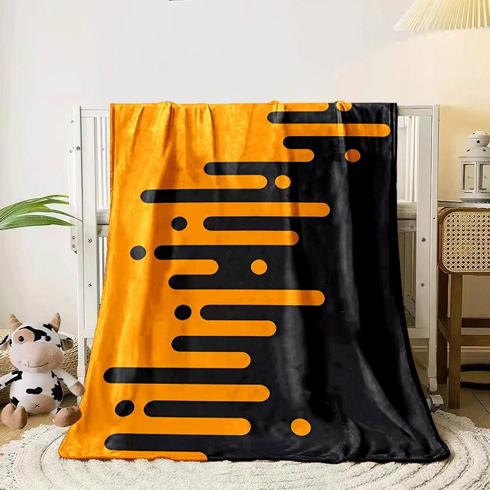 Orange elongated bars and circles merge into a black background diagonally. for all seasons blanket lunch break throw gift