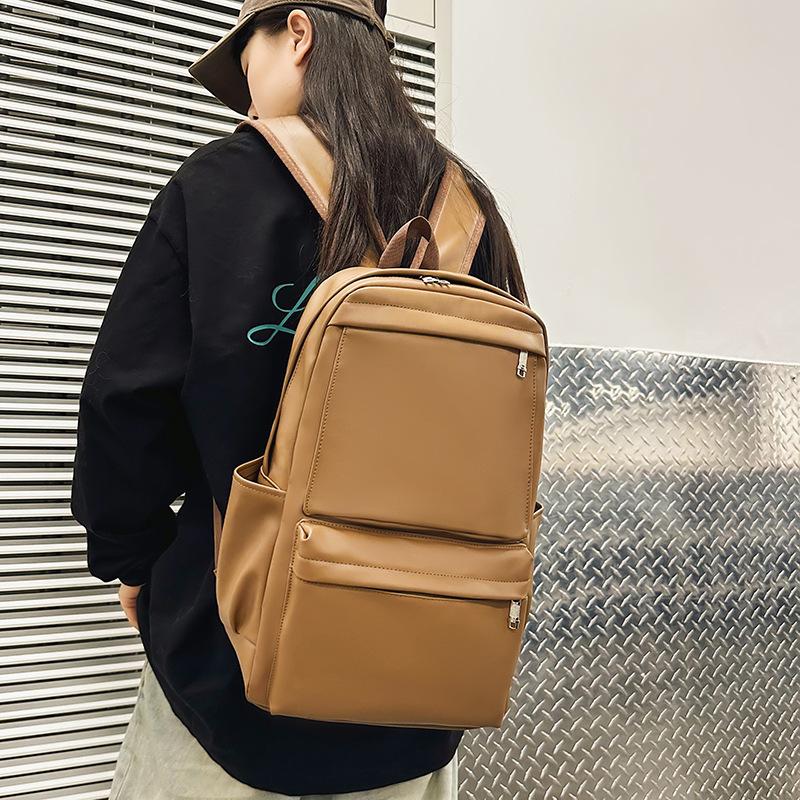 New backpack early spring new casual soft leather men's and women's large-capacity student computer bag