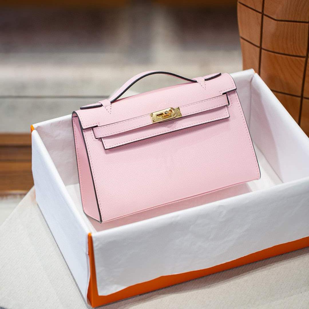 

Ремешок Натуральная кожа Первого поколения Льготная сумка Высококачественная Натуральная кожа Одно отделение Маленькая Мини Сумочка Клатч Сумка на запястье для женщин 22x13x7cm розовый