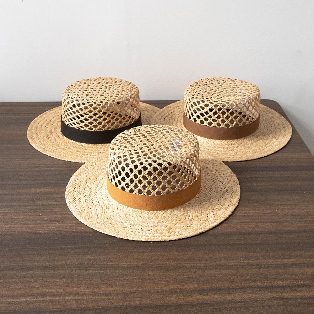 European and American spring and summer new fashion casual hand-woven hollow fleece webbing raffia flat top hat outdoor sunshade straw hat