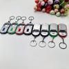Ouvre-bouteille LED Multifonctionnel Mini Lampe de Poche Illuminée Porte-clés Pendentif