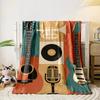The pattern features guitars, a trumpet, a microphone, and a vinyl record. for all seasons blanket lunch break throw gift