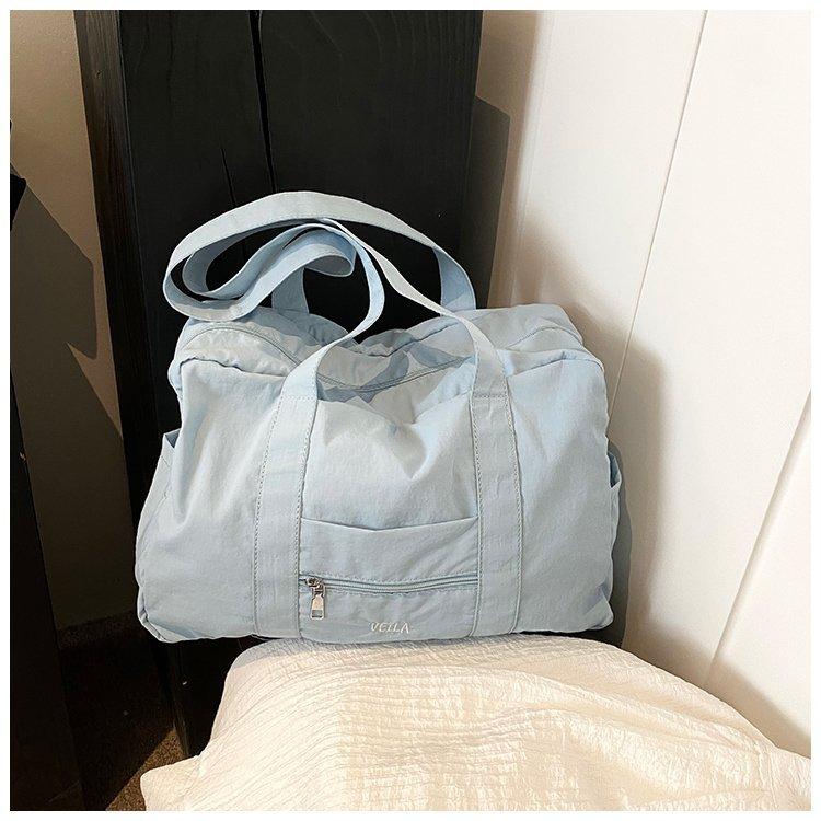 

Lightweight large-capacity tote bag, macaron nylon travel bag, women s 2024 sports shoulder bag, Nanfeng same style. details page світло-синій колір