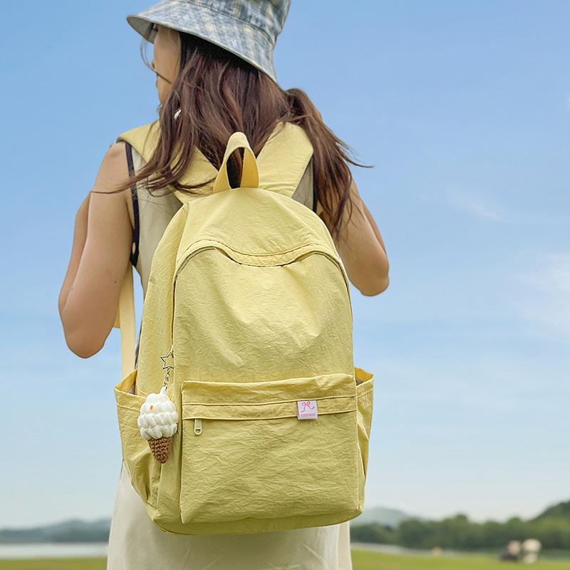 Japanese simple solid color schoolbag female college student casual versatile backpack large capacity junior high school student travel backpack